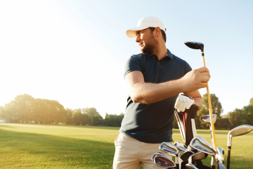 man pulling club out of golf bag